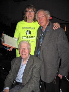 Lyle Christianson (seated) with his daughter, Janice Johnson, Burroughs First Grade teacher, and Lynn Elling, co-founder of Peace Prize Festival at Augsburg.