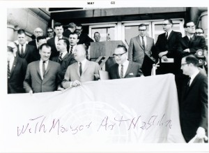 Elmer L. Andersen (center), Mayor Arthur Naftalin (right) and unidentified person with the UN flag before raising May 1, 1968