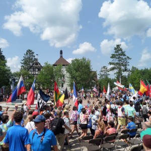 The American flag in procession with others at International Day, Concordia Language Villages, Bemidji MN, August 8, 2014