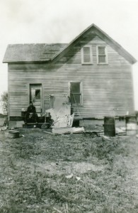 A tired Henry Bernard,visible at left, takes a break while rehabbing the North House in 1947.  Photo is of the east exposure of the house.