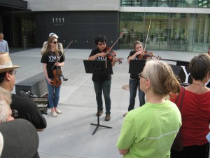 Musicians of YMM perform.  (Right behind their feet you can see the "line" that marks the property of Orchestra Hall, 1111 Nicollet Mall.  That line was a big deal, and voluntarily.   respected. But it was a line of separation....  DO NOT CROSS.