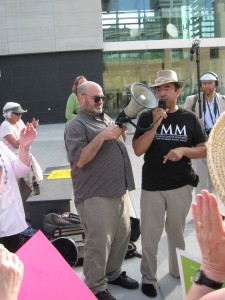 Manny Laureano, first trumpet for the Minnesota Orchestra, speaks at the rally outside Orchestra Hall on September 6.