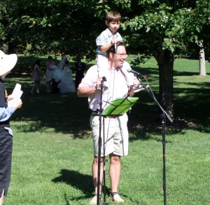 Zander, on his Dad's shoulders, expertly expounds on the importance of protecting the environment (see below) at the Peace Site rededication September 22, 2013