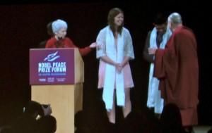 Presentation and re-presentation of shawls at conclusion of Dalai Lama's conversation in Minneapois