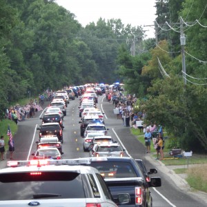I turned around to see the procession of police vehicles as they had just passed by.