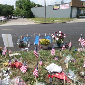 Where Officer Patrick was slain, on Dodd Road, at intersection with Smith Avenue in West St. Paul, MN.  Scene as it appeared after the funeral August 6, 2014