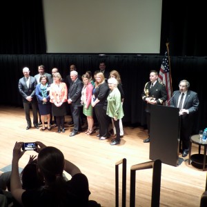 MIC Staff received Award from Gov. General Johnston.  Minneapolis Consul General Jamshed Merchant is at the podium,