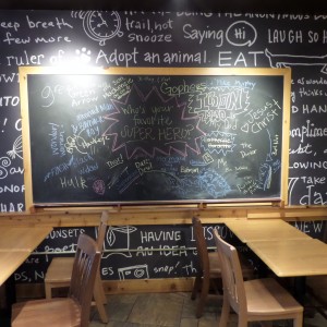 Comments on the 'express yourself' blackboard at Woodbury Caribou Coffee.  Note the question of the day at the center of the blackboard.