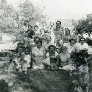 A gathering of women, labelled Berlin (ND) picnic September 7, 1952.  Grandma Busch is at left behind the youngster in front row; Aun Edithe is in the back row, at right.